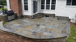 picture of Pennsylvania flagstone patio in backyard with a grill